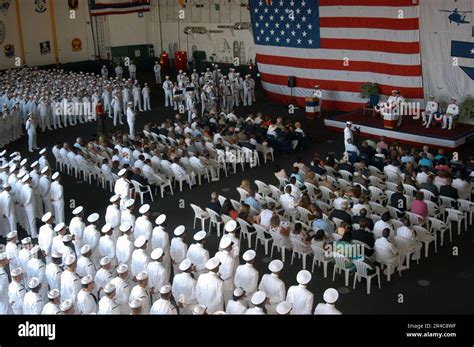 Crew Members And Guests Aboard The Aircraft Carrier Uss John F Kennedy Cv 67 Attend A