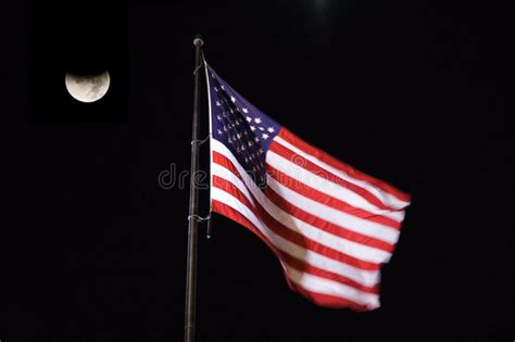 Flying American Flag At Night