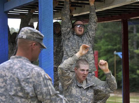 Soldiers In Basic Training Run Through An Obstacle Course As Defense Secretary Leon E Panetta