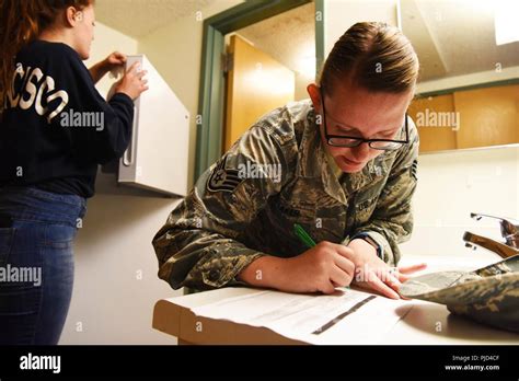 Staff Sgt Hailey Staker An Airman Dorm Leader Completes A Checklist At Ellsworth Air Force Base S D July 17 2018 Dorm Leaders Verify All Processing Paperwork And Ensure Airman Clean Their Rooms